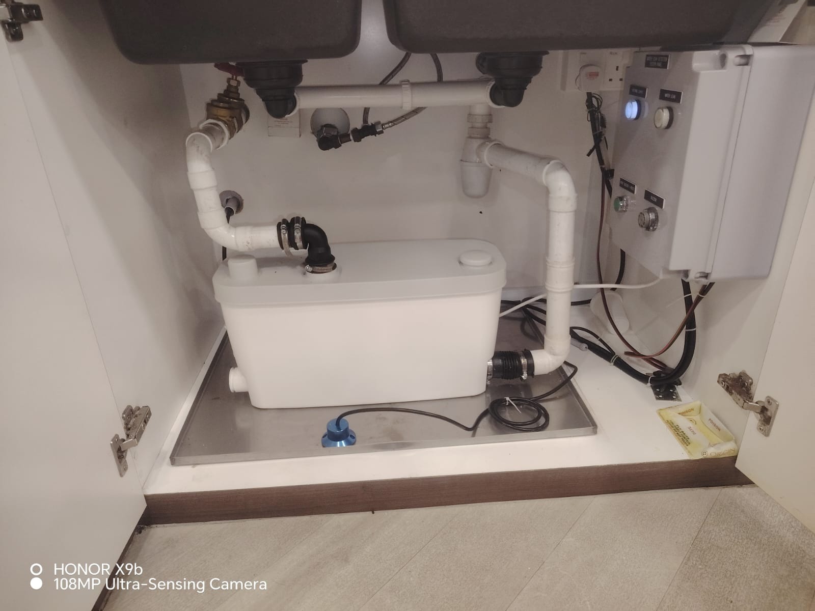 Wilo DrainLift pantry pump system installed under a pantry sink in a Singapore commercial building